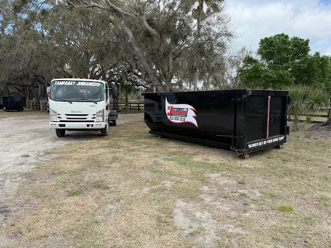 Tampa Bay Junkaneers roll-off dumpster and truck at Ruskin FL property